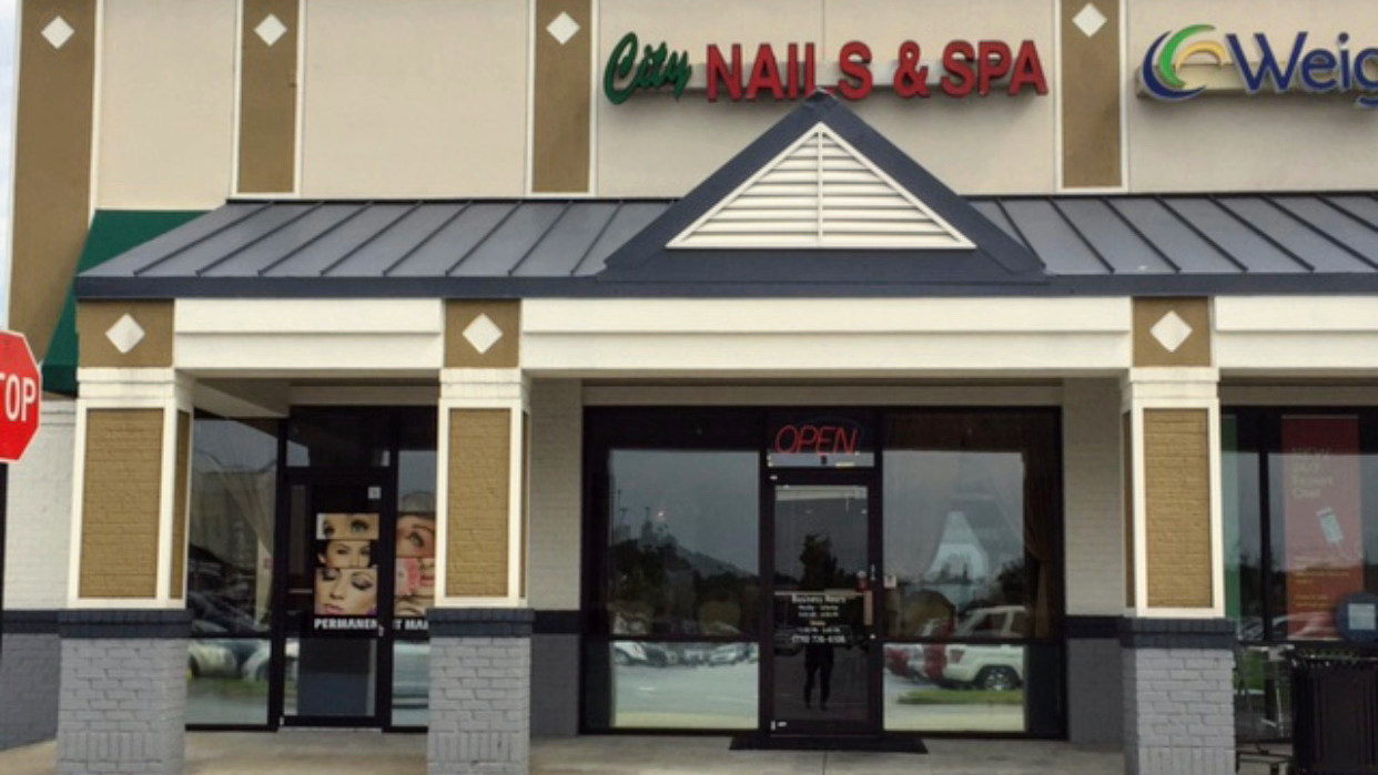 City Nails & Spa logo